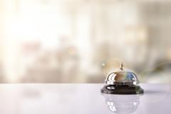 A bell on a hotel lobby desk.