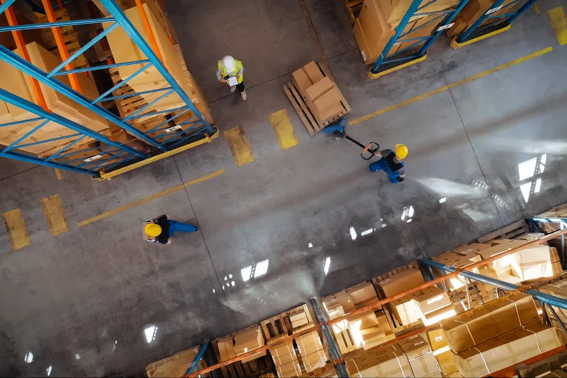 Aerial view of a warehouse with workers moving product